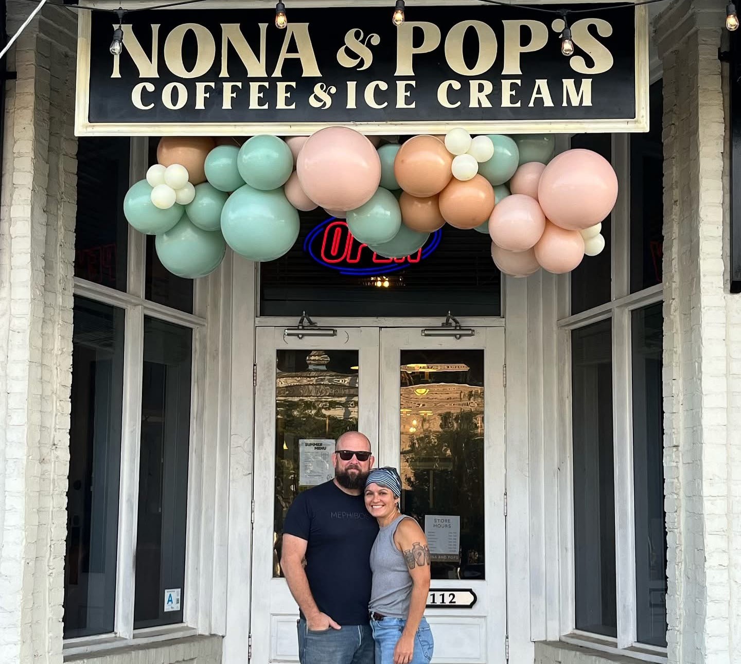 Nona and Pops store front with owners outside